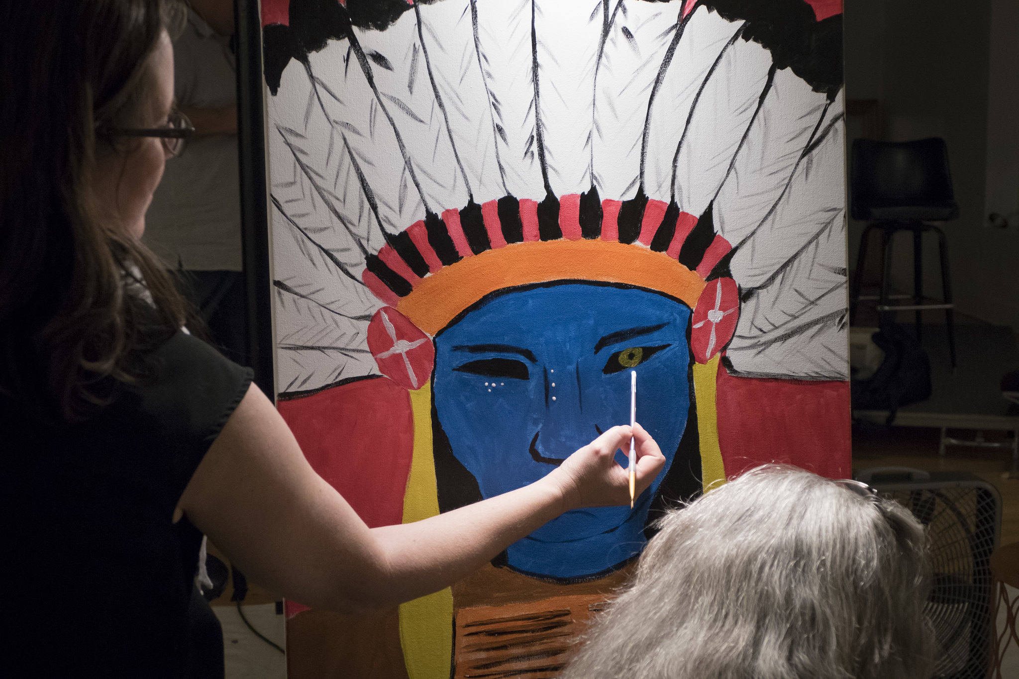 Audience participating in live art workshop