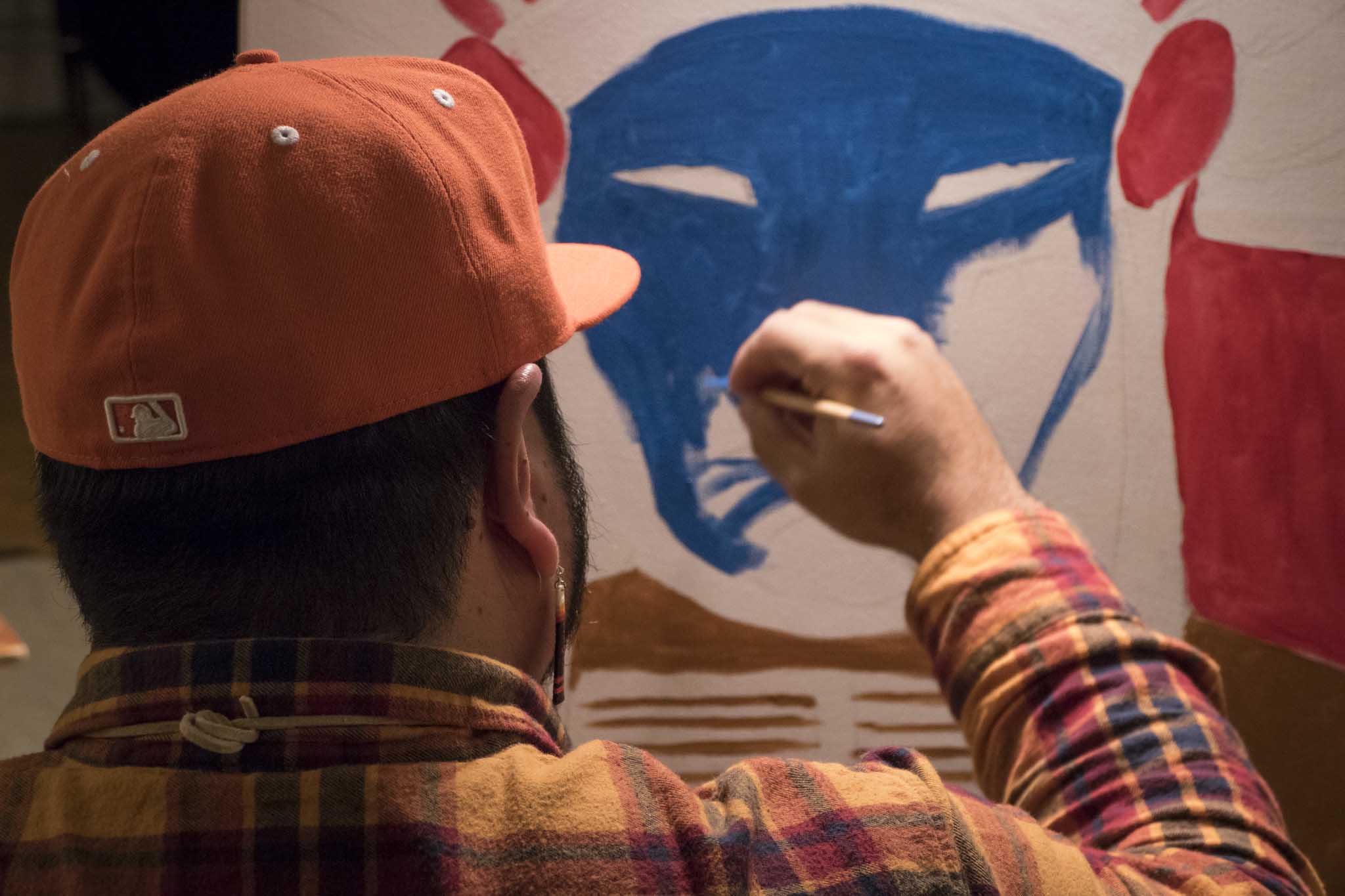Artist Joe Hopkins participating in live art workshop
